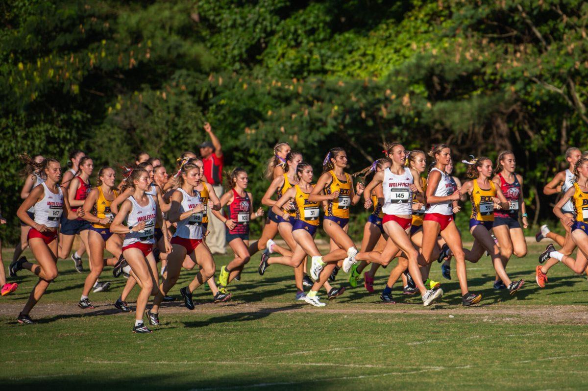 The NC State women's team runs out after the starting gun during the Adidas XC Challenge at WakeMed Soccer Park on Friday, Sept. 20, 2024. The NC State women's team finished in first place with a total of 34 points.