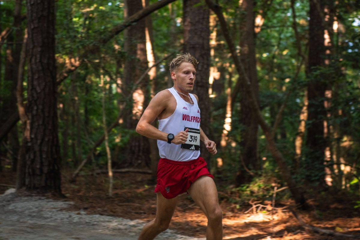 Graduate Kevin Antczak runs through the woods during the Adidas XC Challenge at WakeMed Soccer Park on Friday, Sept. 20, 2024. Antczak finished with a time of 18:31.4. The NC State men's team finished in second place with a total of 51 points.