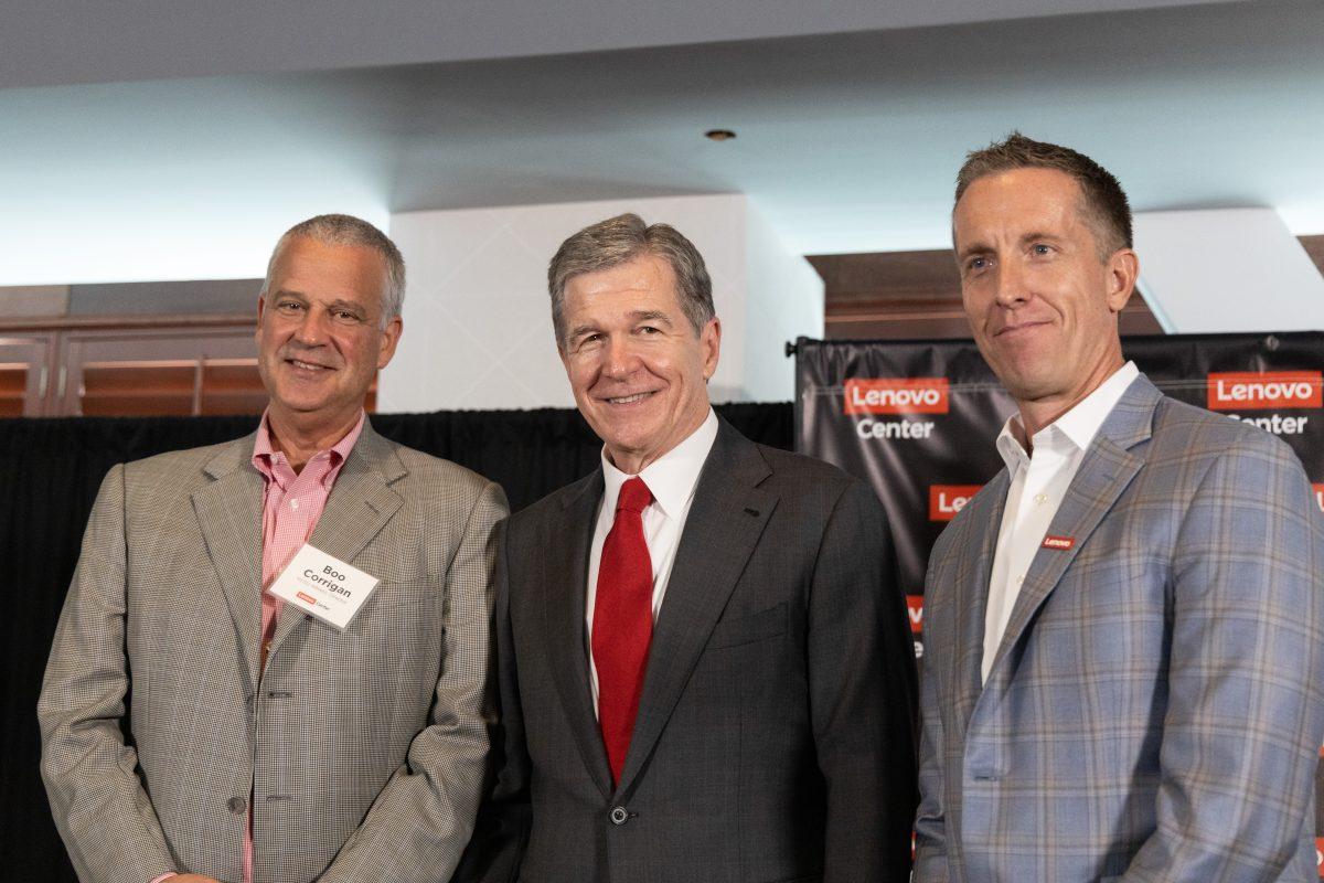 NC State athletic director Boo Corrigan, NC Governor Roy Cooper and Lenovo&#8217;s, SVP and President of North America, Ryan McCurdy at the Lenovo center unveiling on Thursday, Sept. 19, 2024. The Lenovo Center is the new name for the home of NC State Men&#8217;s Basketball, formerly known as PNC Arena.