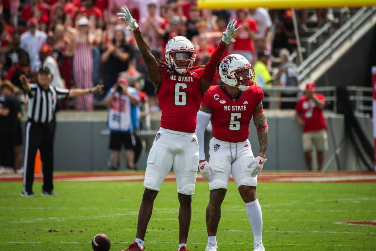 Senior cornerback Corey Coley (left) and senior safety DK Kaufman (right) celebrate after a play during the game against LA Tech at Carter-Finley Stadium on Saturday, Sept. 14, 2024. Coley had five tackles and Kaufman had three tackles and one touchdown during the game. The Wolfpack beat the Bulldogs 30-20.