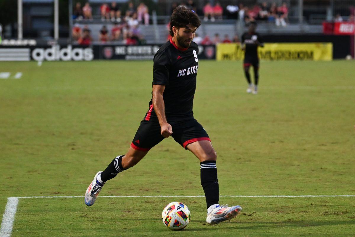 Junior forward Santiago Hoyos L&#243;pez passes the ball during the Wolfpack's home game against the Stetson Hatters at Dail Soccer Field on Friday, Sept. 13, 2024. NC State went on to tie Stetson 1-1.