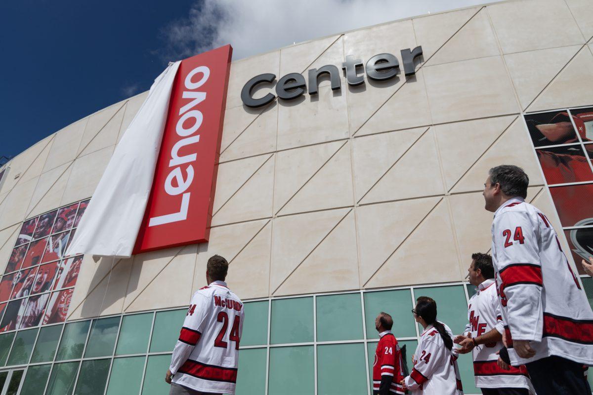 Lenovo executives watch as the new sign is uncovered at the Lenovo Center unveiling on Thursday, Sept. 19, 2024. Lenovo&#8217;s, SVP and President of North America, Ryan McCurdy led the charge for Lenovo at the unveiling.