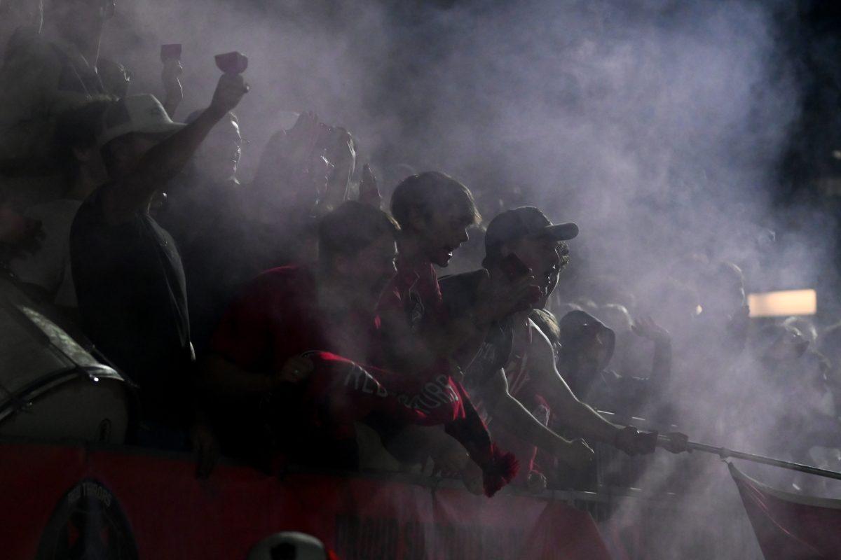 NC State students celebrate following a late-game goal during the NC State versus Stetson men's soccer game at Dail Soccer Field on Friday, Sept. 13, 2024. The NC State Wolfpack tied the Stetson Hatters 1-1.