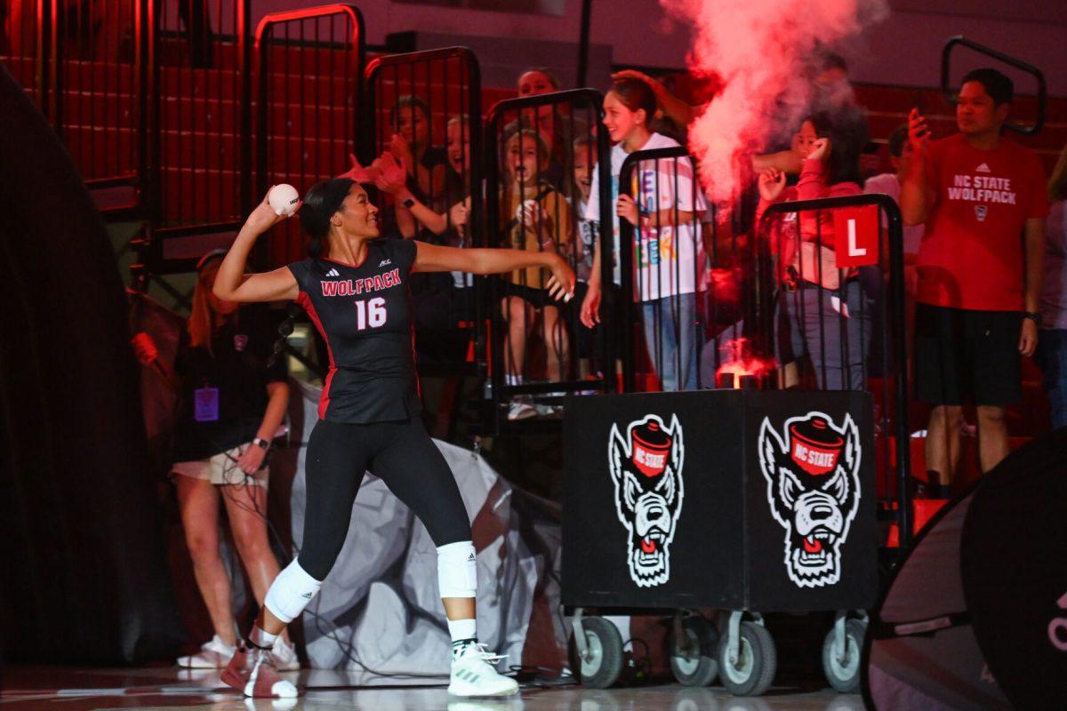Senior middle blocker Jada Allen throws a ball during starting lineup announcements in Reynolds Coliseum on Sunday, Sept. 22, 2024. The Wolfpack lost to the Chanticleers 3-2.