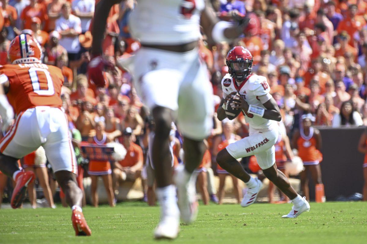 Freshman quarterback CJ Bailey runs with the ball during the football game against Clemson in Memorial Stadium on Saturday, Sept. 21, 2024. Bailey passed for 204 yards and scored one touchdown.&#160;&#160;Clemson beat NC State 59-35.