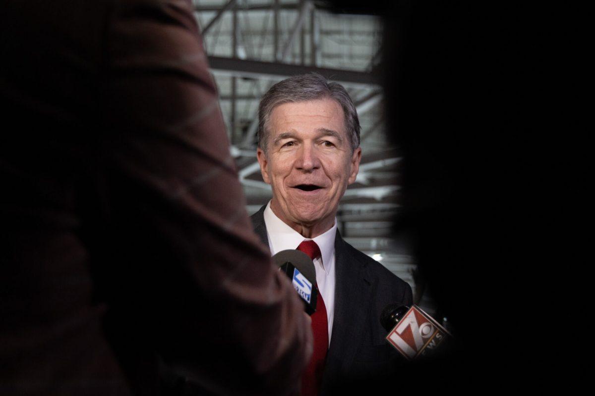 NC Governor Roy Cooper questioned by the press at the Lenovo Center unveiling on Thursday, Sept. 19, 2024. Governor Cooper takes this election cycle off as he is term-limited from running for governor again.