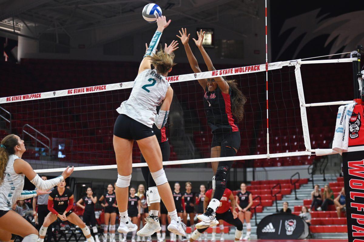 Redshirt Senior outside hitter Madison Williams blocks the ball during the game against Coastal Carolina in Reynolds Coliseum on Sunday, Sept. 22, 2024. Williams had 11 digs. The Wolfpack lost to the Chanticleers 3-2.