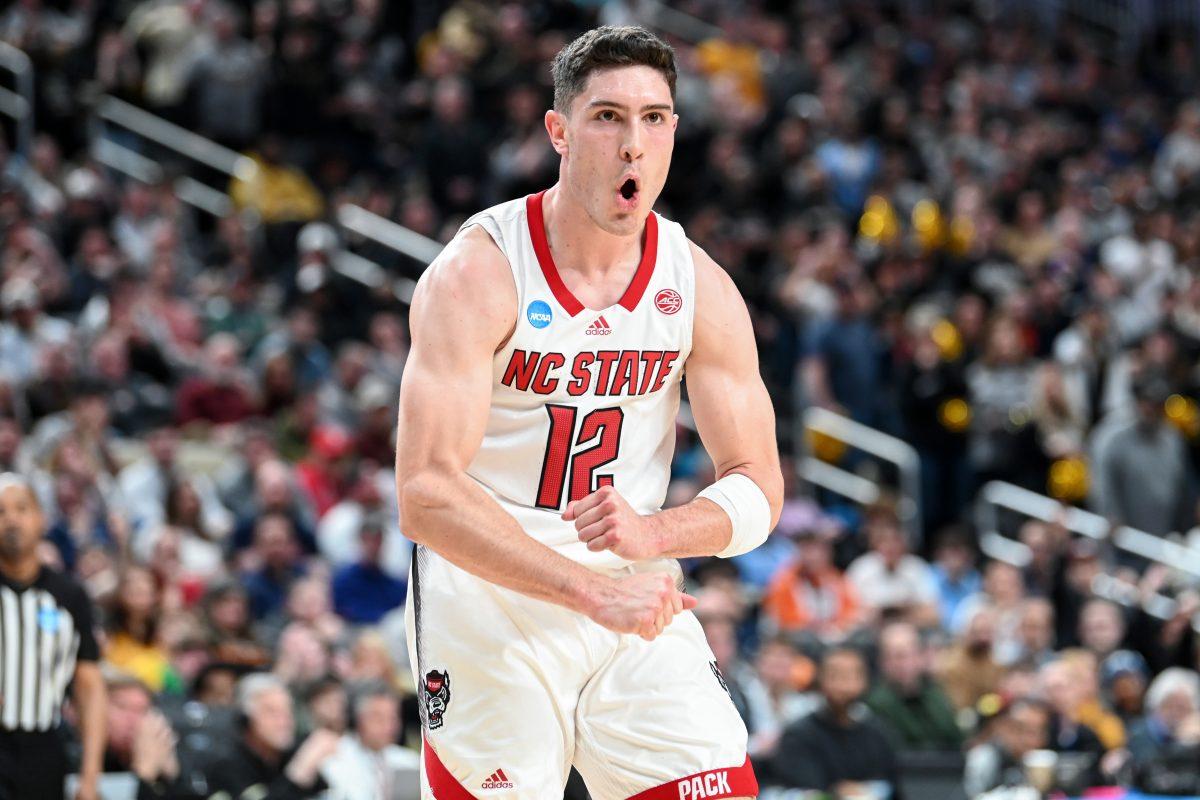 Graduate guard Michael O'Connell celebrates during the second round game of the NCAA Tournament against Oakland at PPG Paints Arena in Pittsburgh on Saturday, March 23, 2024. O'Connell scored 12 points and made eight assists. NC State beat Oakland 79-73 in overtime to advance to the Sweet 16.
