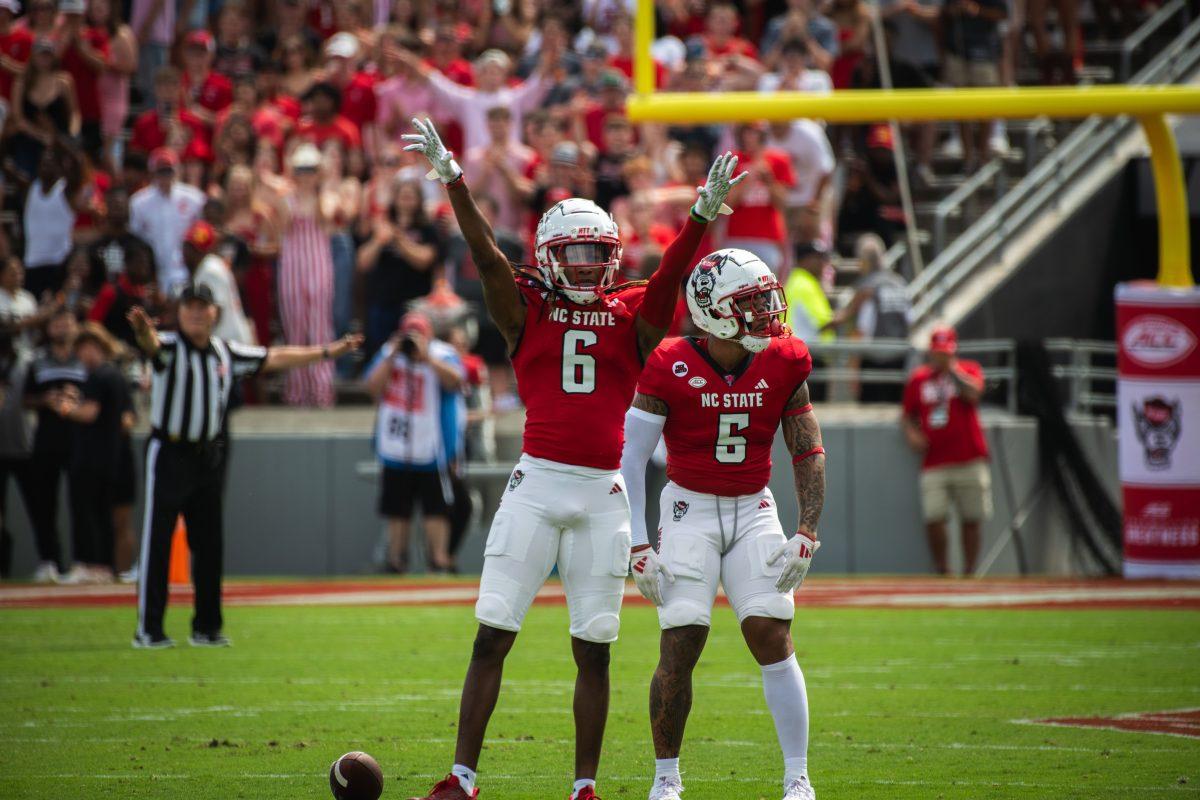 Senior cornerback Corey Coley (left) and senior safety DK Kaufman (right) celebrate after a play during the game against LA Tech at Carter-Finley Stadium on Saturday, Sept. 14, 2024. Coley had five tackles and Kaufman had three during the game. The Wolfpack beat the Bulldogs 30-20.