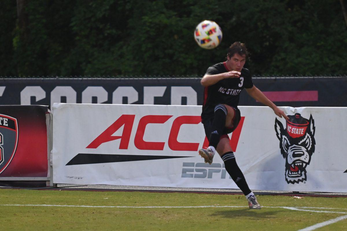 Graduate defender Liam Bennett kicks the ball into the field at NC State's game against Stetson University at Dail Soccer Field on Friday, Sept. 13, 2024. The Wolfpack tied with the Hatters 1-1.