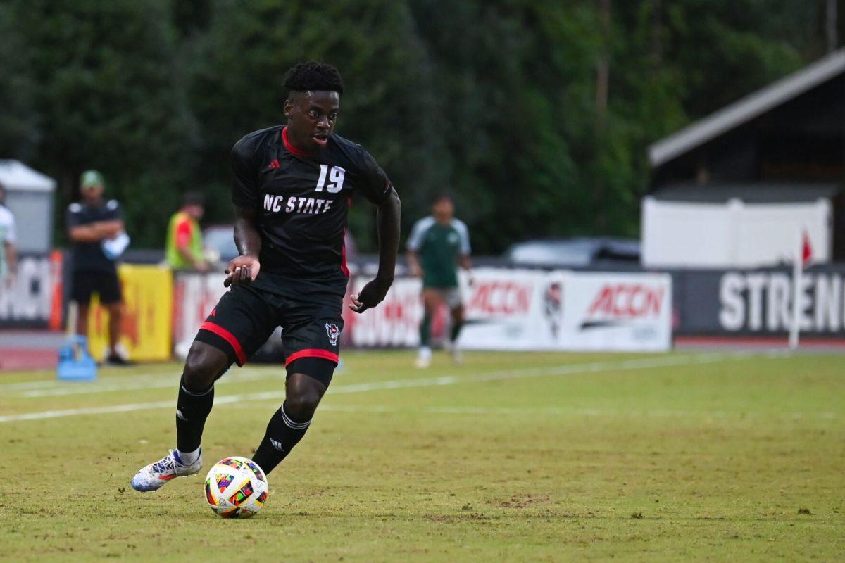Senior defender Yves Tcheuyap passes the ball during the Wolfpack's home game against the Stetson Hatters at Dail Soccer Field on Friday, Sept. 13, 2024. The Wolfpack tied the Hatters 1-1.