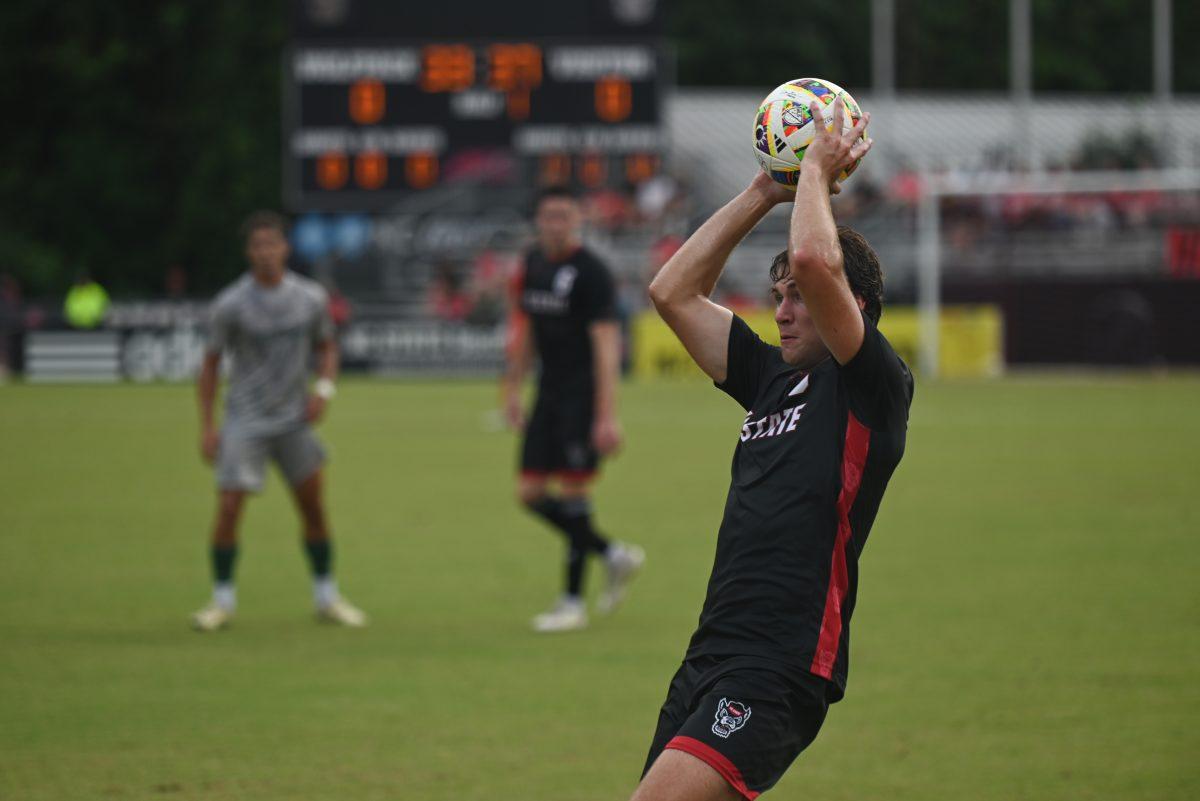 Graduate defender Liam Bennett throws the ball into the field during NC State's home game against Stetson at Dail Soccer Field on Friday, Sept. 13, 2024. The Wolfpack tied the Hatters 1-1.