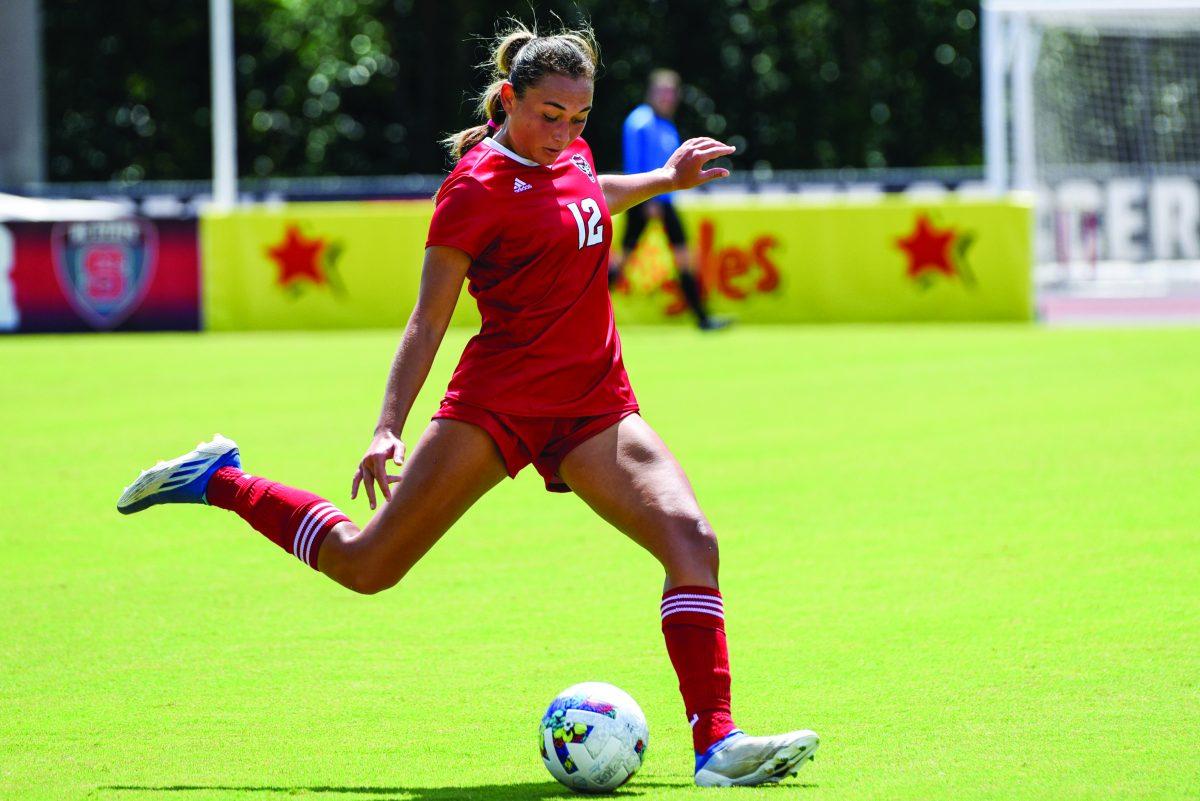 Senior midfielder Jaiden Thomas prepares to kick the ball during the match against Harvard on Sunday, Sept. 4, 2022 at Dail Soccer Field. NC State lost 2-0.
