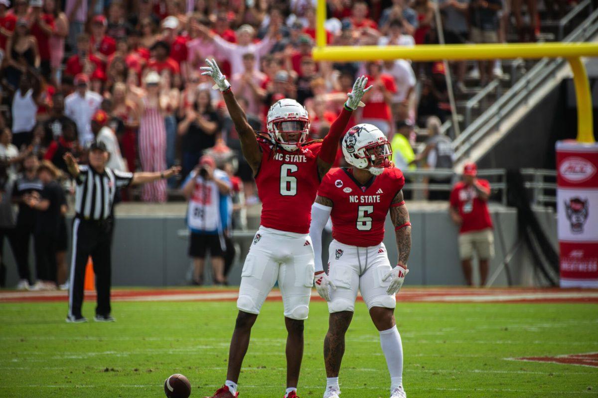 Senior cornerback Corey Coley (left) and senior safety DK Kaufman (right) celebrate after a play during the game against LA Tech at Carter-Finley Stadium on Saturday, Sept. 14, 2024. Coley had five tackles and Kaufman had three during the game. The Wolfpack beat the Bulldogs 30-20.