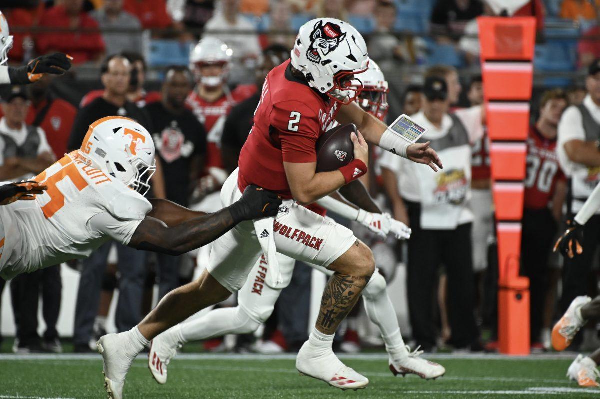 Graduate quarterback Grayson McCall runs the ball during the Wolfpack's game against the Tennessee Volunteers in Bank of America Stadium for the Duke's Mayo Classic on Saturday, Sept. 8, 2024. The Wolfpack lost to the Volunteers 51-10.