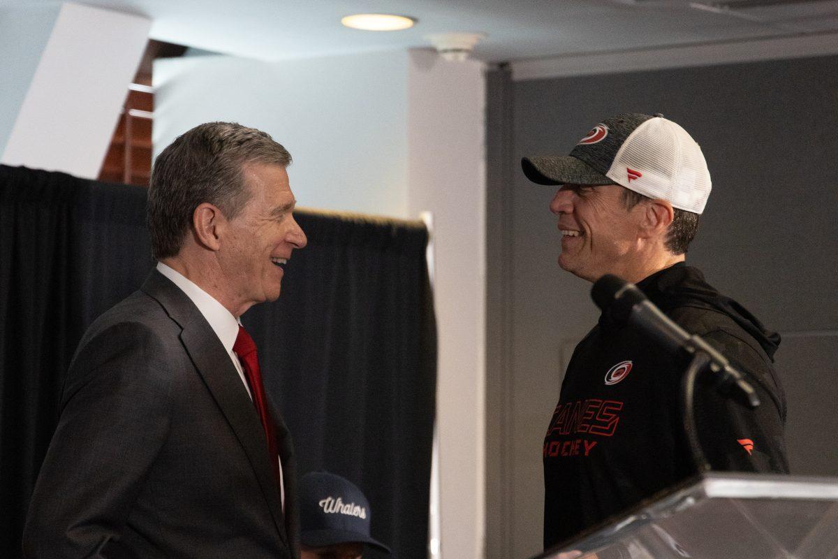NC Governor Roy Cooper Speaking with Carolina Hurricanes head coach Rod Brind'Amour at the Lenovo center unveiling on Thursday, Sept. 19, 2024. The Lenovo Center is the new name for the home of the Carolina Hurricanes, formerly known as PNC Arena.