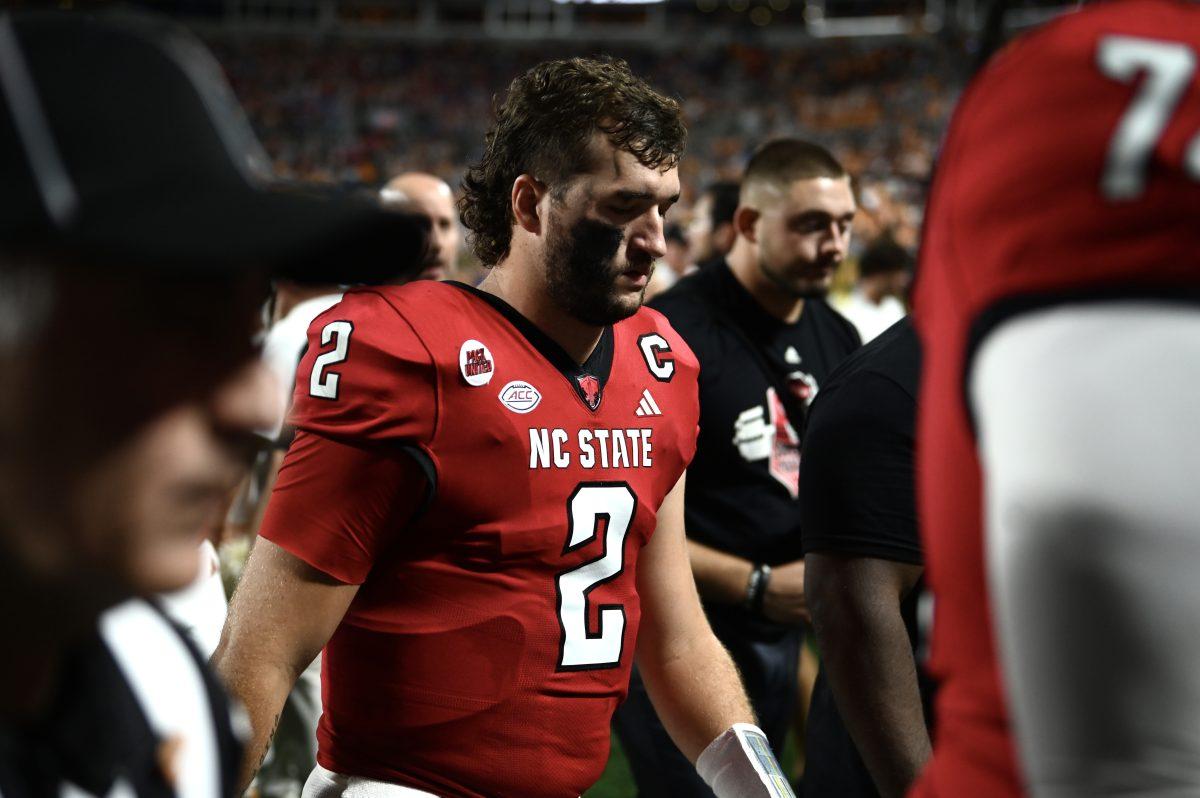 Graduate quarterback Grayson McCall walks off the field at halftime of the Wolfpack's game against the Tennessee Volunteers in Bank of America Stadium for the Duke's Mayo Classic on Saturday, Sept. 8, 2024. McCall was responsible for three turnovers. The Wolfpack lost to the Volunteers 51-10.