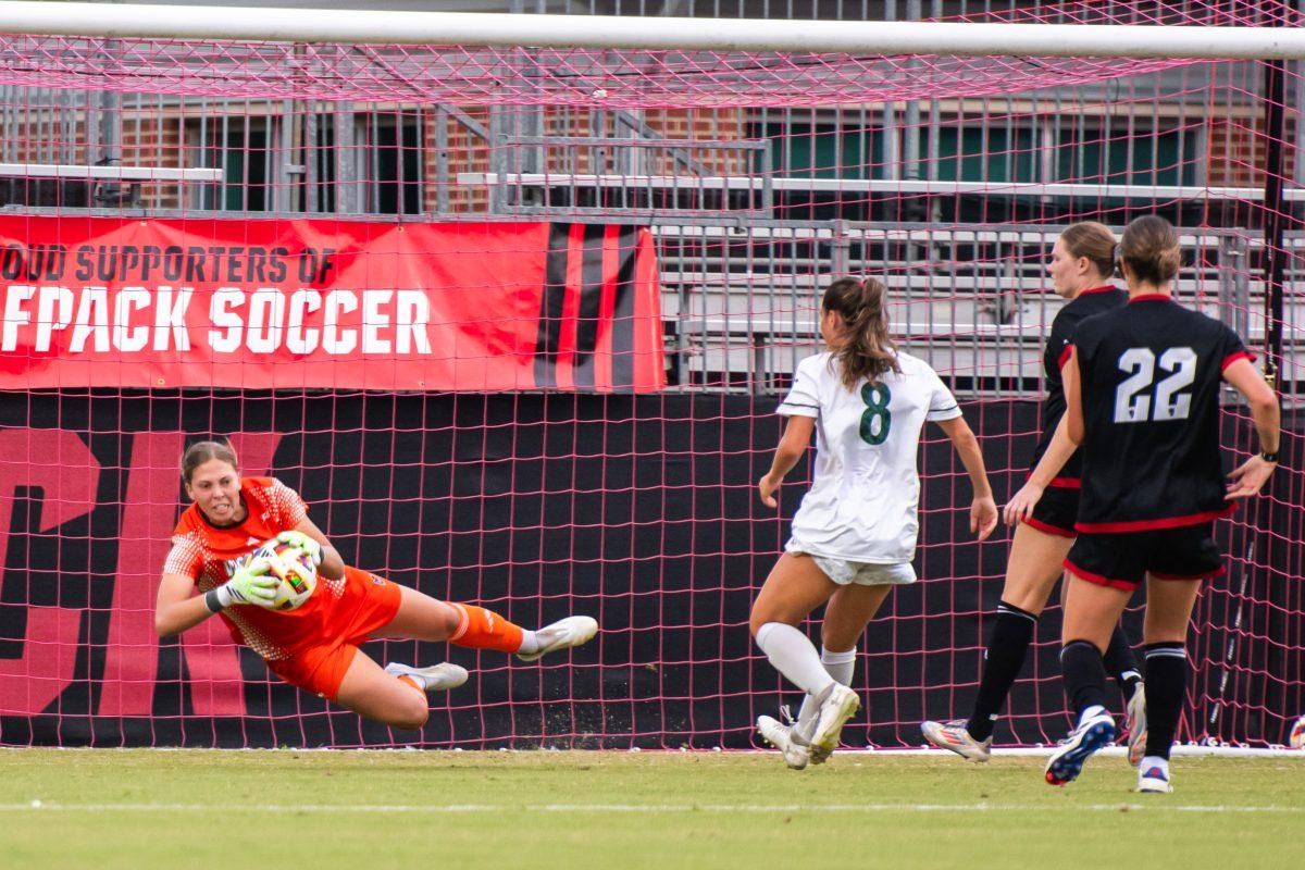 Junior goalkeeper Olivia Pratapas saves the ball during the match against William &amp; Mary on Thursday, Sept. 12, 2024 at Dail Soccer Field. Pratapas had three saves during the match. NC State lost 1-0.