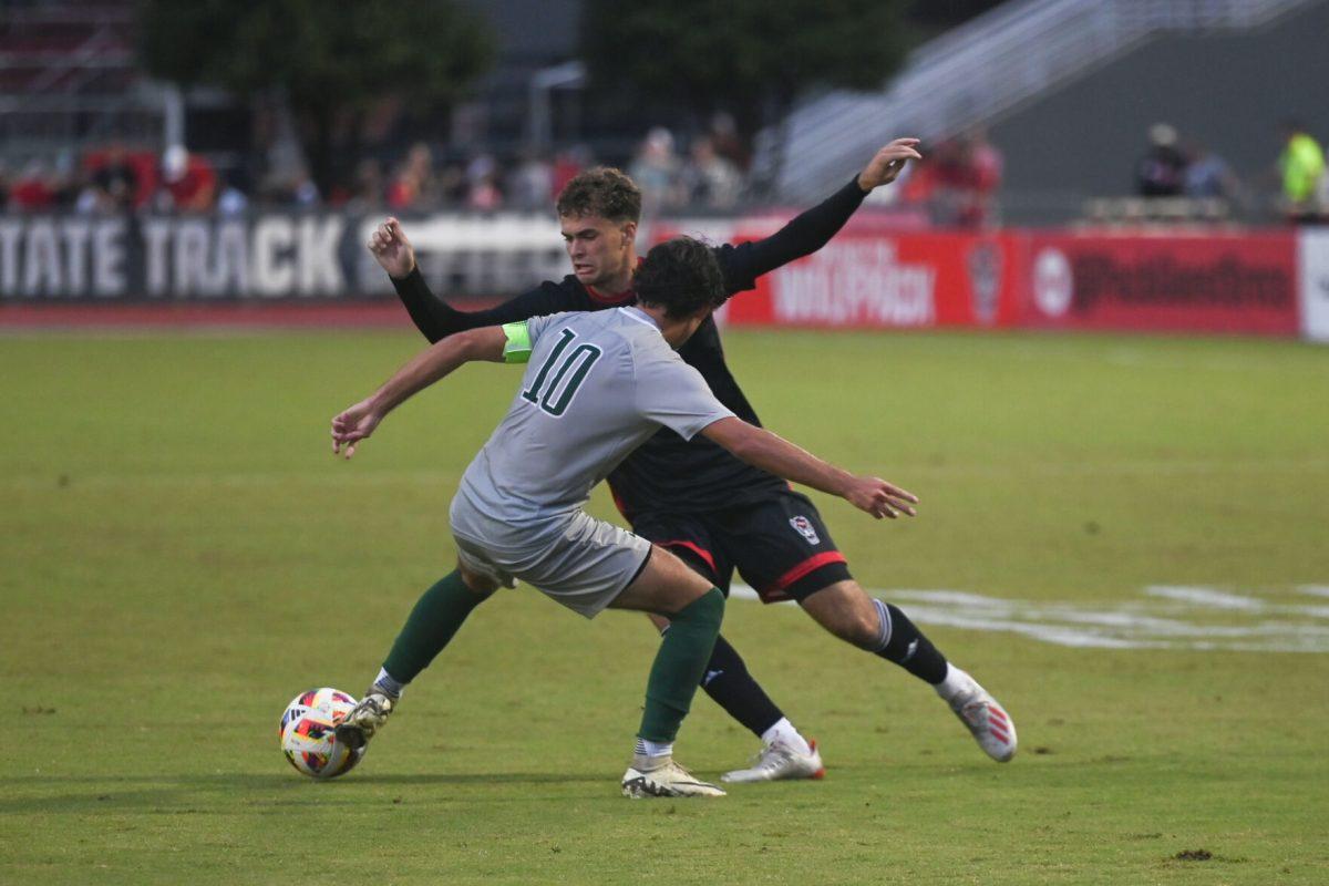 Junior forward Drew Lovelace fights for possession of the ball at NC State's game against Stetson University at Dail Soccer Field on Friday, Sept. 13, 2024. The Wolfpack and the Hatters tied 1-1.