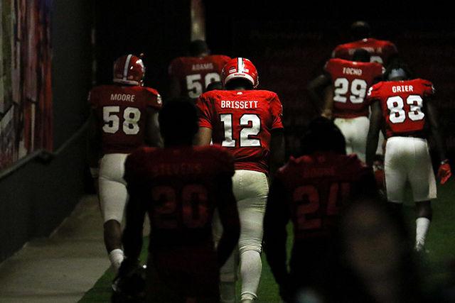 Redshirt senior quarterback Jacoby Brissett walks into the tunnel for the last time after losing his last home game. Brissett finished with 17 for 37 passes completed and 207 yards with 2 touchdowns and one interception. Brissett also had 20 rushes for 128 yards and 2 touchdowns. The NC State Wolfpack fell to the UNC Tarheels, in the last home game of the season, 45-34 at Carter-Finley Stadium on November 28, 2015.