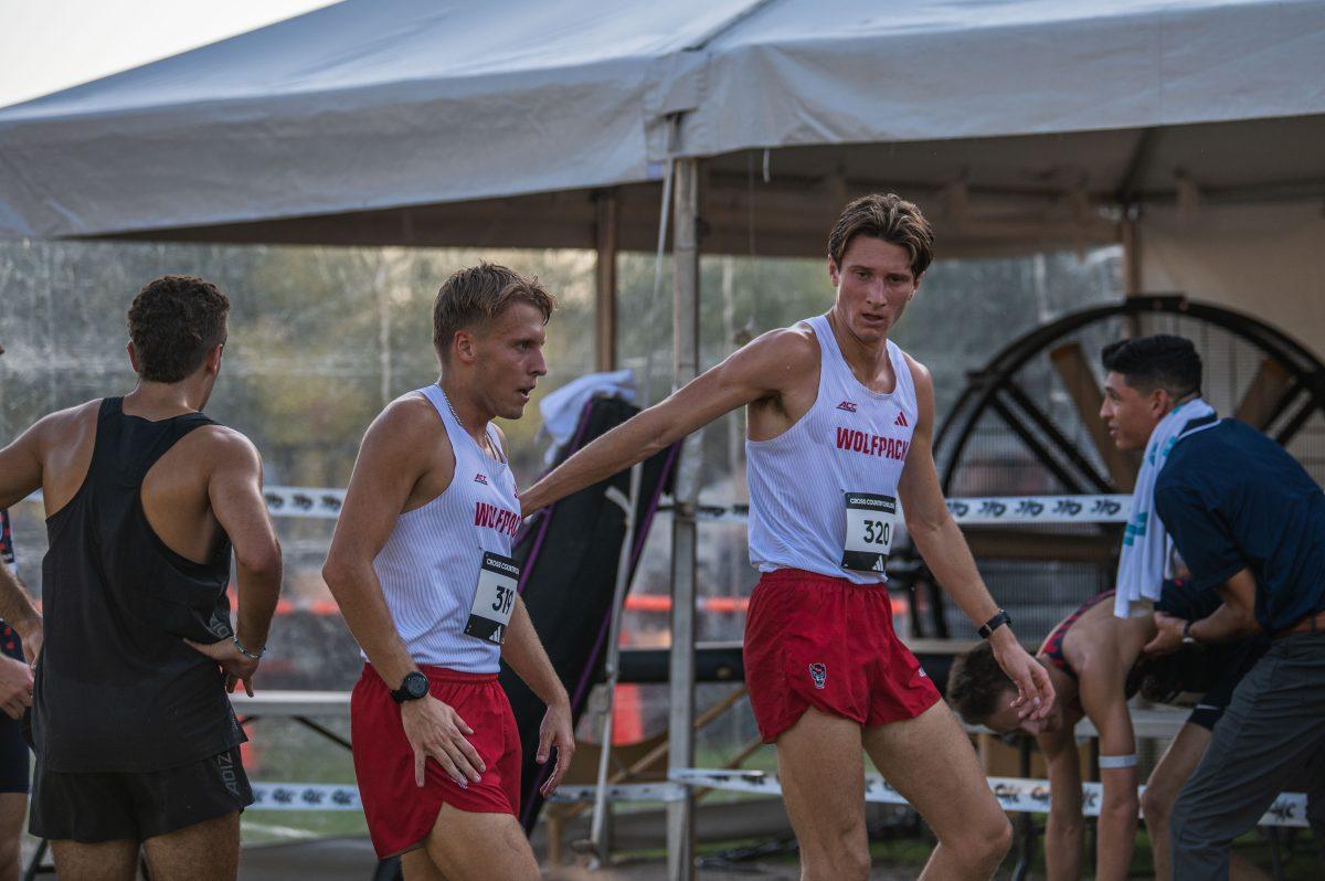 Senior Matt Bogdan (right) congratulates graduate Kevin Antczak (left) during the Adidas XC Challenge at WakeMed Soccer Park on Friday, Sept. 20, 2024. Antczak finished with a time of 18:31.4 and Bogdan finished in 18:32.3. The NC State men's team finished in second place with a total of 51 points.