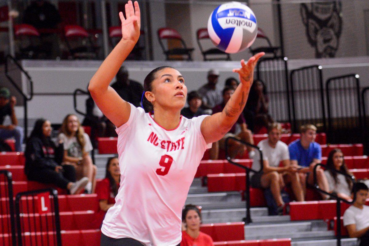 Graduate Skye Stokes serves the ball during the match against Liberty in Reynolds Coliseum on Wednesday, Sept. 11, 2024. Stokes had three aces and 15 digs. The Wolfpack defeated the Flames 3-1.