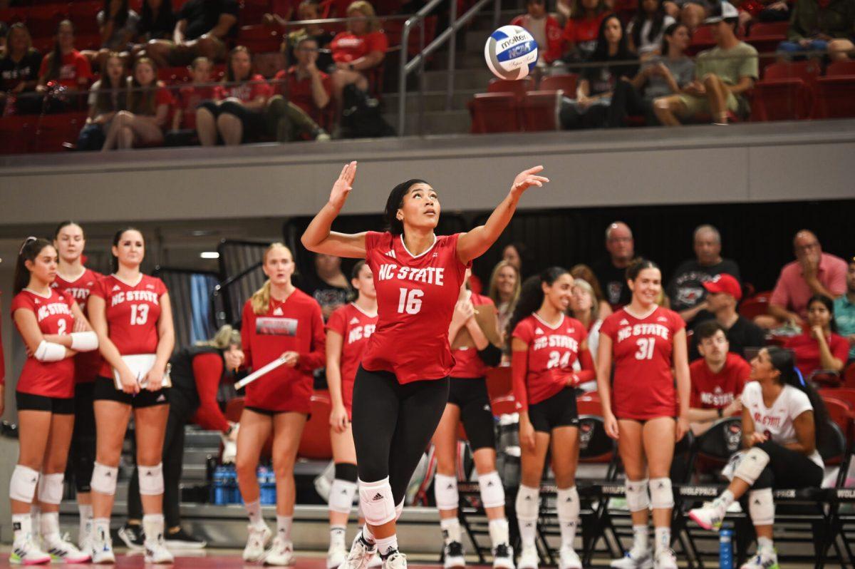 Senior middle blocker Jada Allen serves the ball in NC State's home game against UVA at Reynolds Coliseum on Sunday, Sept. 29, 2024. NC State went on to win against UVA, winning three sets to two.