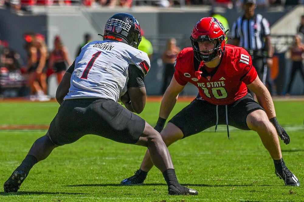 Redshirt junior linebacker Caden Fordham attempts to make an open field tackle during the football game against Northern Illinois at Carter-Finley Stadium on Saturday, Sept. 28, 2024. Fordham finished with 14 total tackles and six solo tackles. The Wolfpack beat the Huskies 24-17.