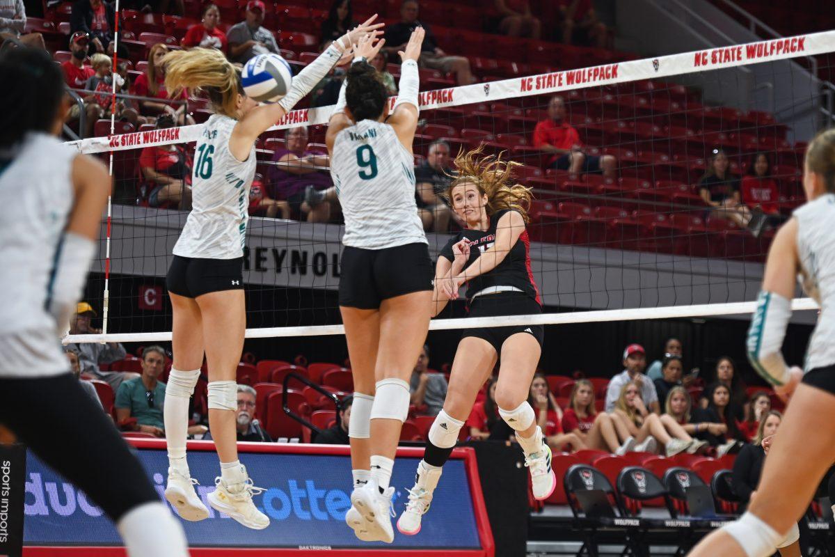 Senior opposite hitter Amanda Rice spikes the ball during the game against Coastal Carolina in Reynolds Coliseum on Sunday, Sept. 22, 2024. Rice had 18 kills. The Wolfpack lost to the Chanticleers 3-2.