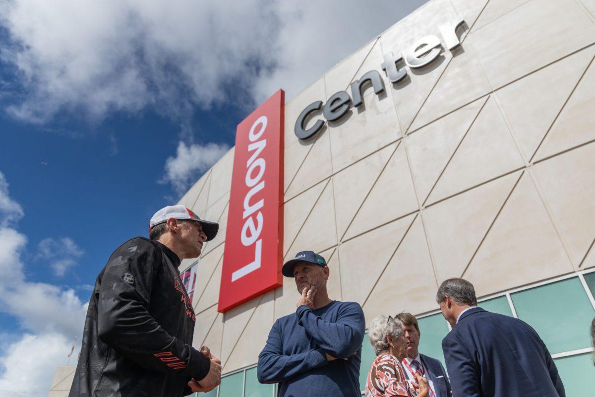 Carolina Hurricanes head coach Rod Brind'Amour and owner Tom Dundon talk in front of the new sign at the Lenovo Center unveiling on Thursday, Sept. 19, 2024. The Hurricanes host their first game at the Lenovo Center on Sept. 27, 2024.