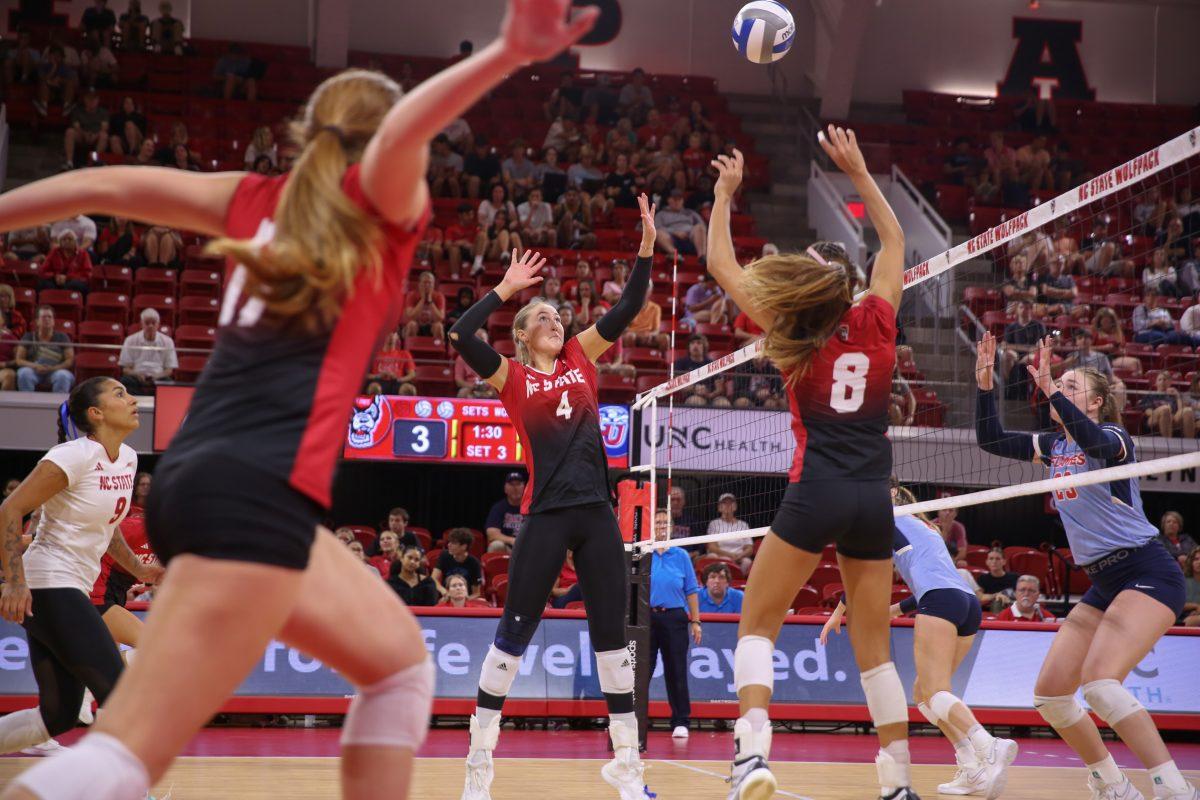 Junior middle blocker Sophie Groom prepares to jump for the ball during the game against Liberty University on Wednesday, Sept. 11, 2024. Groom made six kills. The Wolfpack defeated the Flames 3-1.