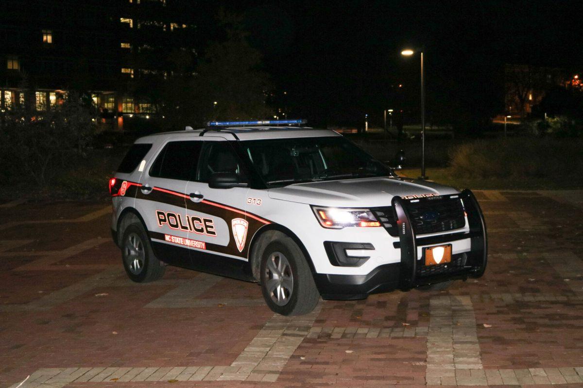 An NC State police car sits in the brickyard on Tuesday, Nov. 20, 2018. The campus police department provides services including the wolf guard identification and ride along program, safety escort services and lost and found property.