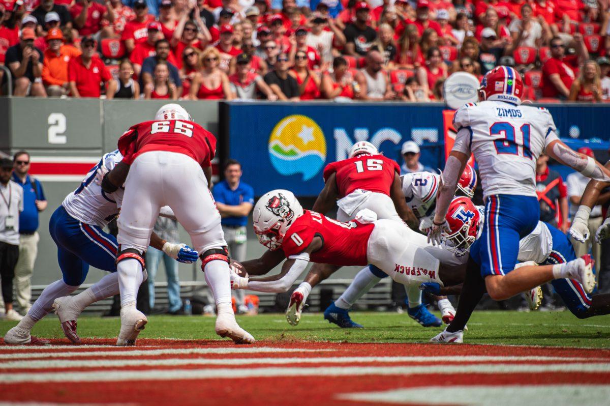 Sophomore running back Kendrick Raphael dives to score a touchdown during the game against LA Tech at Carter-Finley Stadium on Saturday, Sept. 14, 2024. Raphael had 63 rushing yards and scored one touchdown during the game. The Wolfpack beat the Bulldogs 30-20