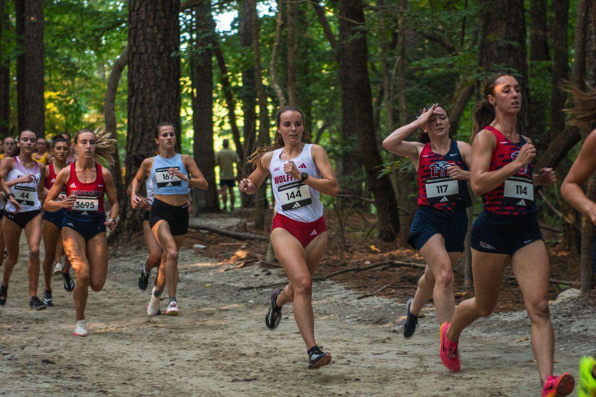 Junior Olivia Haas makes her way through the forest loop during the Adidas XC Challenge at WakeMed Soccer Park on Friday, Sept. 20, 2024. Haas finished with a time of 18:19.6. The NC State women's team finished in first place with a total of 34 points.