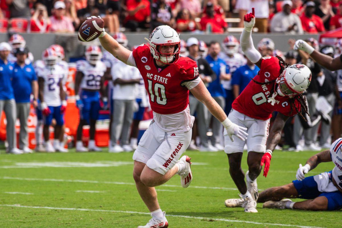 Redshirt junior linebacker Caden Fordham celebrates after intercepting the ball during the game against LA Tech at Carter-Finley Stadium on Saturday, Sept. 14, 2024. Fordham had 11 tackles during the game. The Wolfpack beat the Bulldogs 30-20.