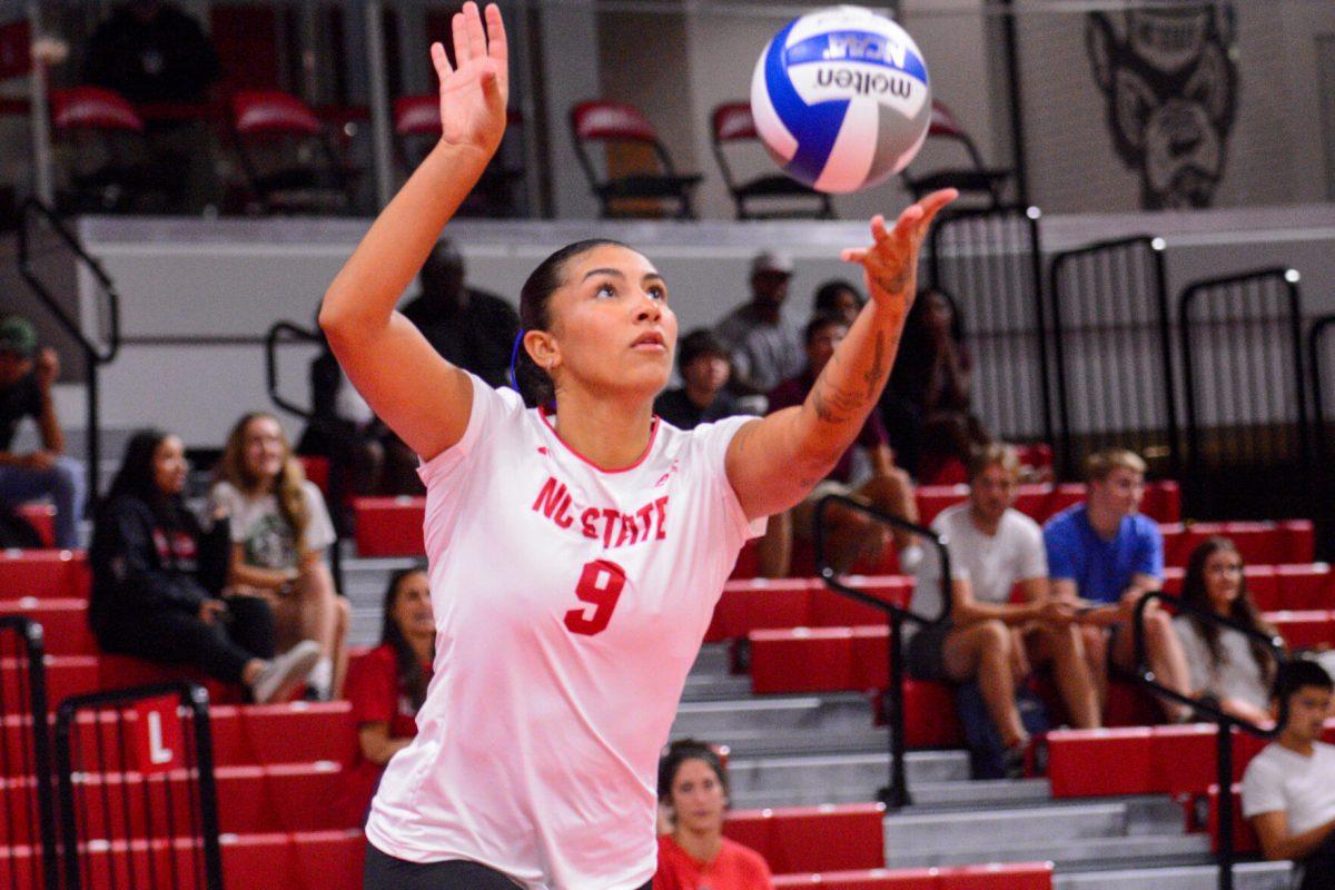 Graduate Skye Stokes serves the ball during the match against Liberty in Reynolds Coliseum on Wednesday, Sept. 11, 2024. Stokes had three aces and 15 digs. The Wolfpack defeated the Flames 3-1.