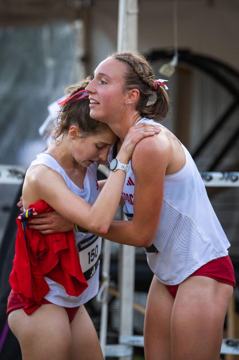 Junior Grace Hartman hugs senior Fiona Smith during the Adidas XC Challenge at WakeMed Soccer Park on Friday, Sept. 20, 2024. Hartman finished fourth with a time of 16:25.1 and Smith finished in 16:53.8. The NC State women's team finished in first place with a total of 34 points.