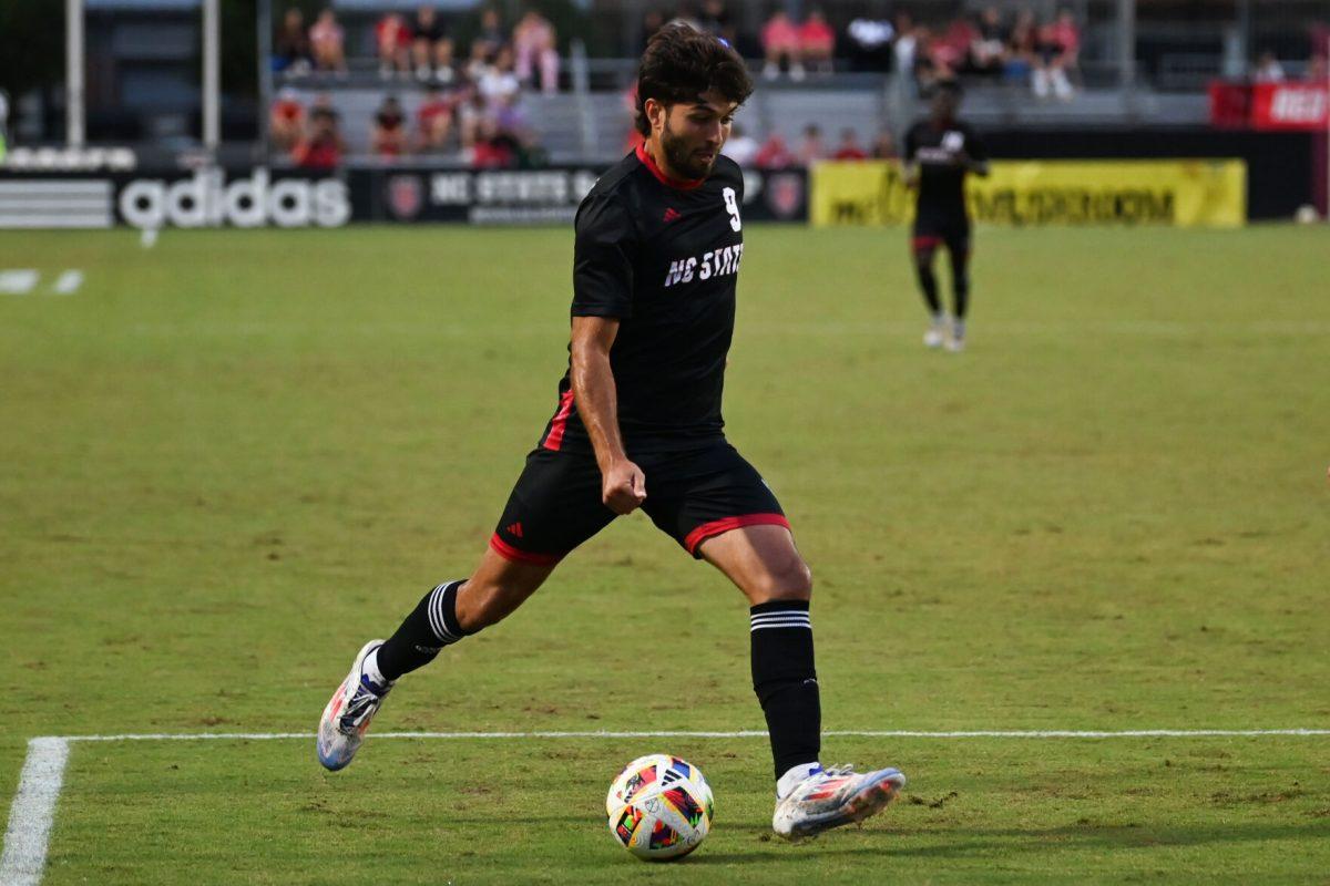 Junior forward Santiago Hoyos L&#243;pez passes the ball during the Wolfpack's home game against the Stetson Hatters at Dail Soccer Field on Friday, Sept. 13, 2024. NC State went on to tie Stetson 1-1.