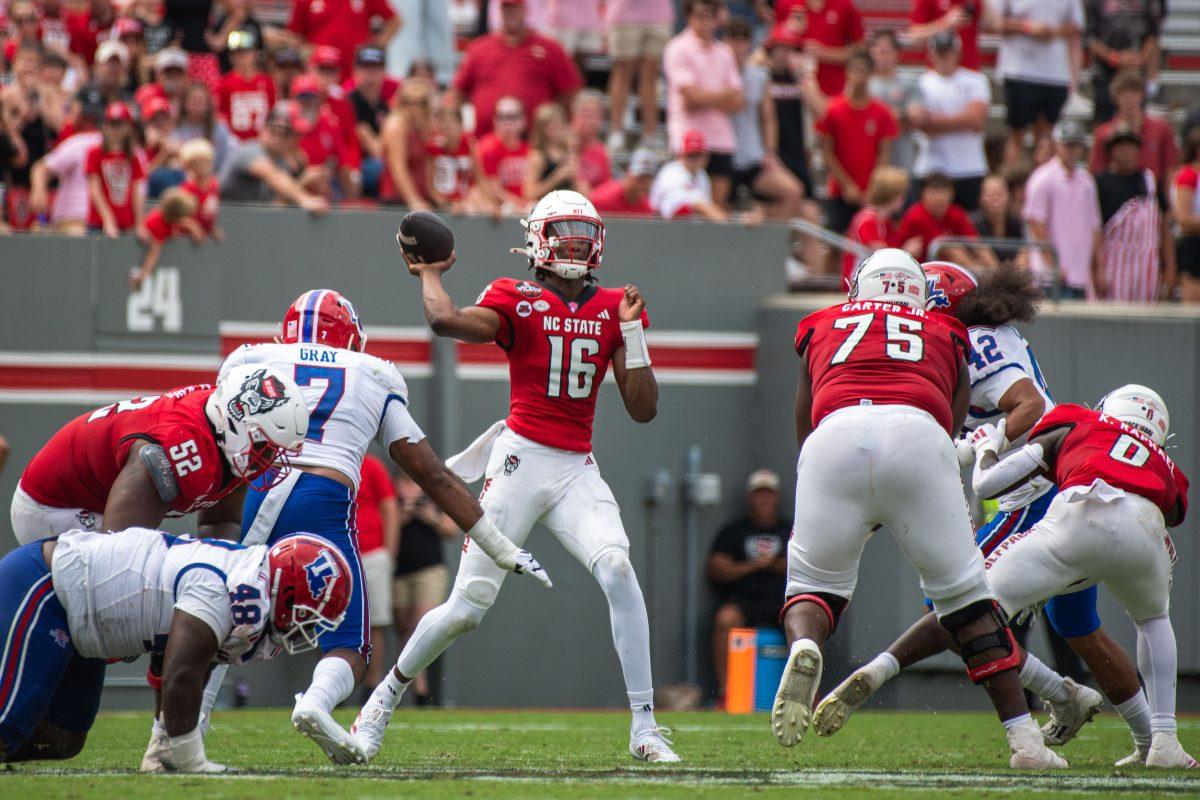 Freshman quarterback C.J. Bailey throws the ball during the game against LA Tech at Carter-Finley Stadium on Saturday, Sept. 14, 2024. Bailey had 156 passing yards during the game. The Wolfpack beat the Bulldogs 30-20.