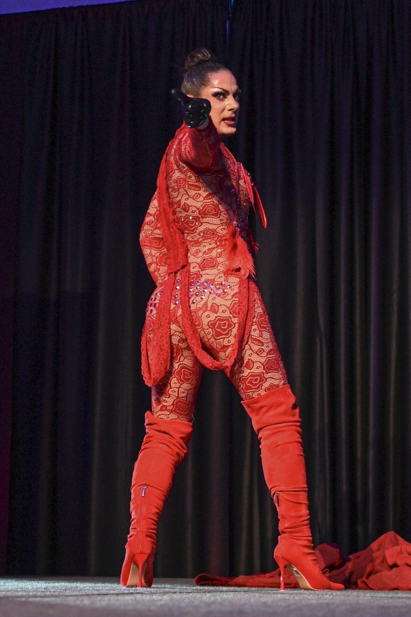 Drag queen Nadia Rain swings their head around and points to the crowd at Drag and Deserts in the State Ballroom on Thursday, September 19, 2024.