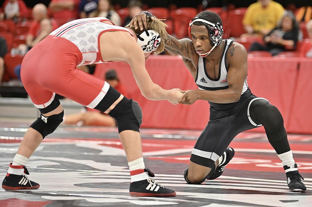 Redshirt freshman Vince Robinson creates distance from freshman Louie Gill at Wrestle-Offs in Reynolds Coliseum on Saturday, Oct. 26, 2024. Robinson defeated Gill via technical fall 19-3.