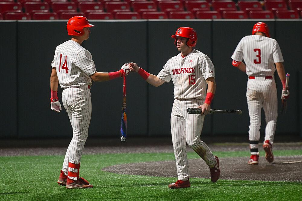 Redshirt sophomore catcher and outfielder Drew Lanphere returns to the dug-out after scoring a run during the game against Elon on Wednesday, Oct. 9, 2024 at Doak Field at Dail Park. The Wolfpack defeated the Phoenixes 20-4.