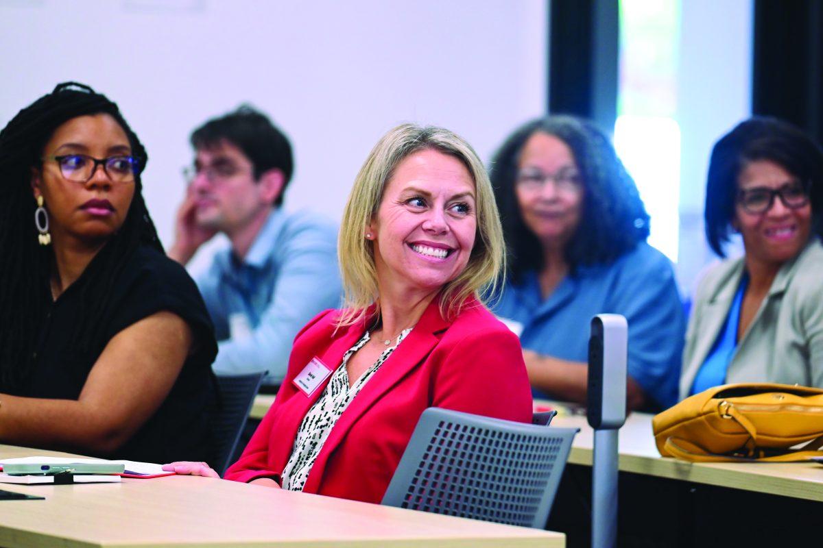 Sarah Hall, Director of the Institute for Emerging Issues, laughs during an Energy Week conversation at Partners I on Thursday, Oct. 3, 2024. The conversation was titled Leading the Clean Energy Transition and featured a discussion with Dr. Henry McKoy, Senior Advisor to the Undersecretary for the U.S. Office of Science and Innovation, focused on the future of sustainable energy and community impact.