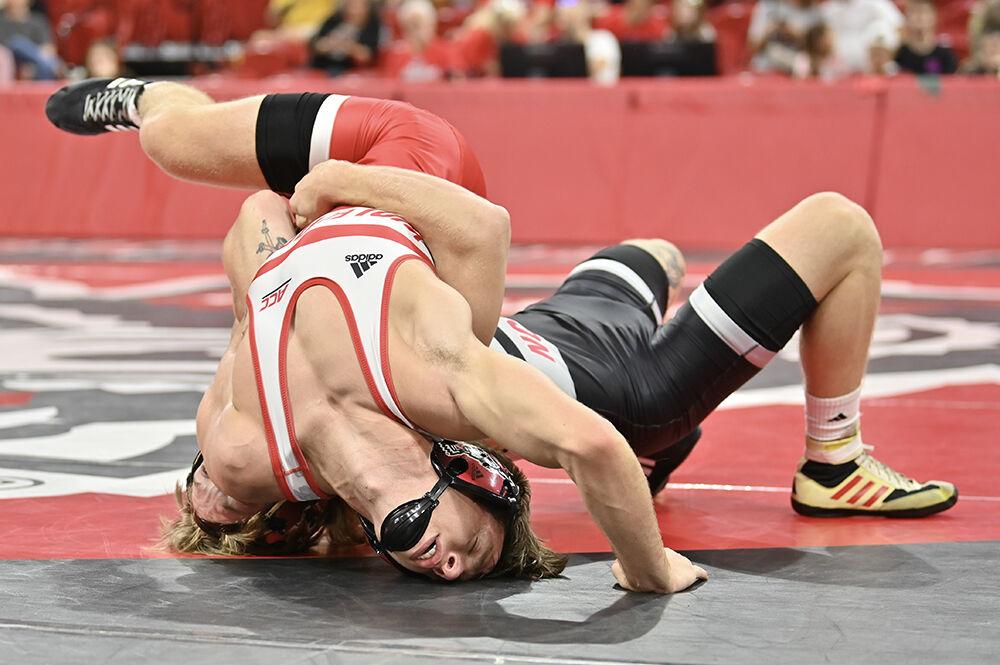 Freshman Gavin Linsman fights from his back against redshirt senior Kai Orine at Wrestle-Offs in Reynolds Coliseum on Saturday, Oct. 26, 2024. Orine won via technical fall against Linsman 18-2.