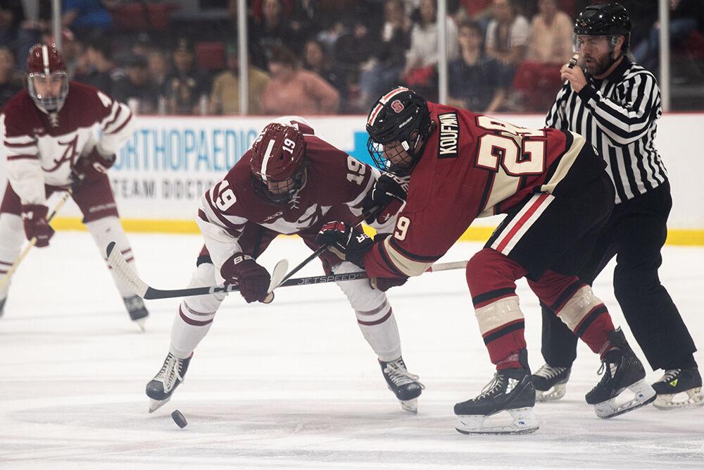 sophomore forward Holden Koufman fights for the puck during match against Alabama at Invisalign Arena on Saturday, Oct. 5, 2024. Koufman scored two goals. NC State beat Alabama 5-2.