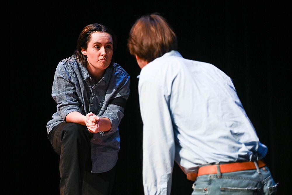 Kat O'Neil Cupp, a fourth-year in theatre studies and studying communication, converses with John Henry Hackett, a third-year in film studies and studying communication, during the dress rehearsal of "Teletype" in Kennedy-McIlwee Studio Theater on Wednesday, Oct. 2, 2024. Cupp played the role of Jim Blizzard and Hackett performed as character Sam Hatter.