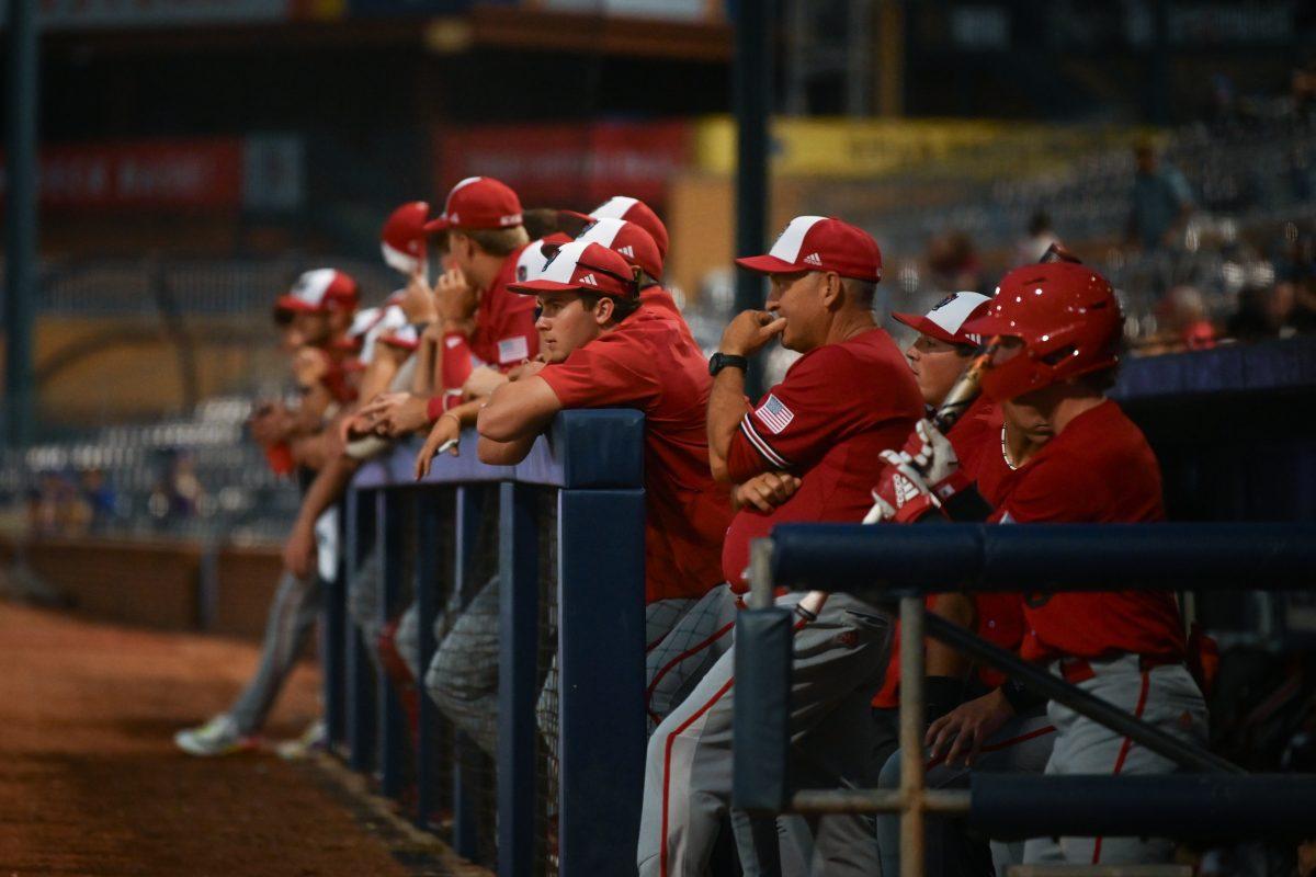 The NC State baseball team watches the field from the dugout at the Durham Bulls Athletic Park during the Wolfpack's fall games against the Duke Blue Devils on Friday, Oct. 4, 2024. The Blue Devils beat The Wolfpack 5-2 in both of the fall games in Durham.