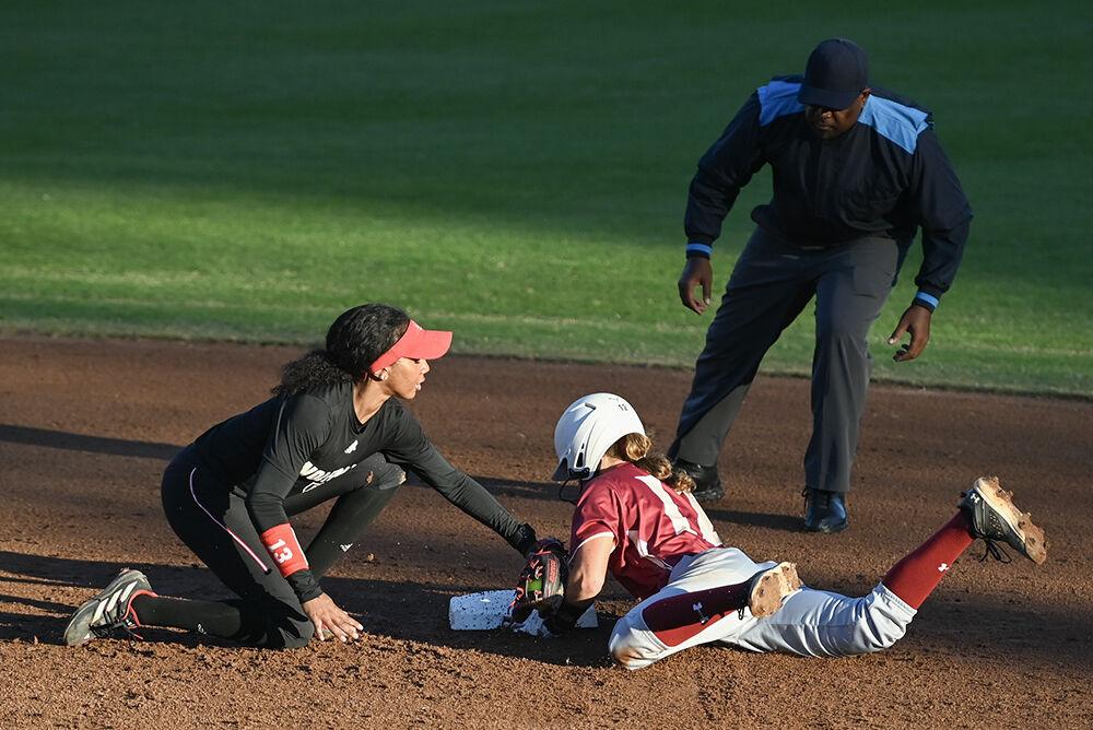 Junior utility player MaKayla Marbury tags a runner during the game against Elon at Dail Softball Stadium on Wednesday, Oct. 23, 2024. The Wolfpack won the game 14-7.