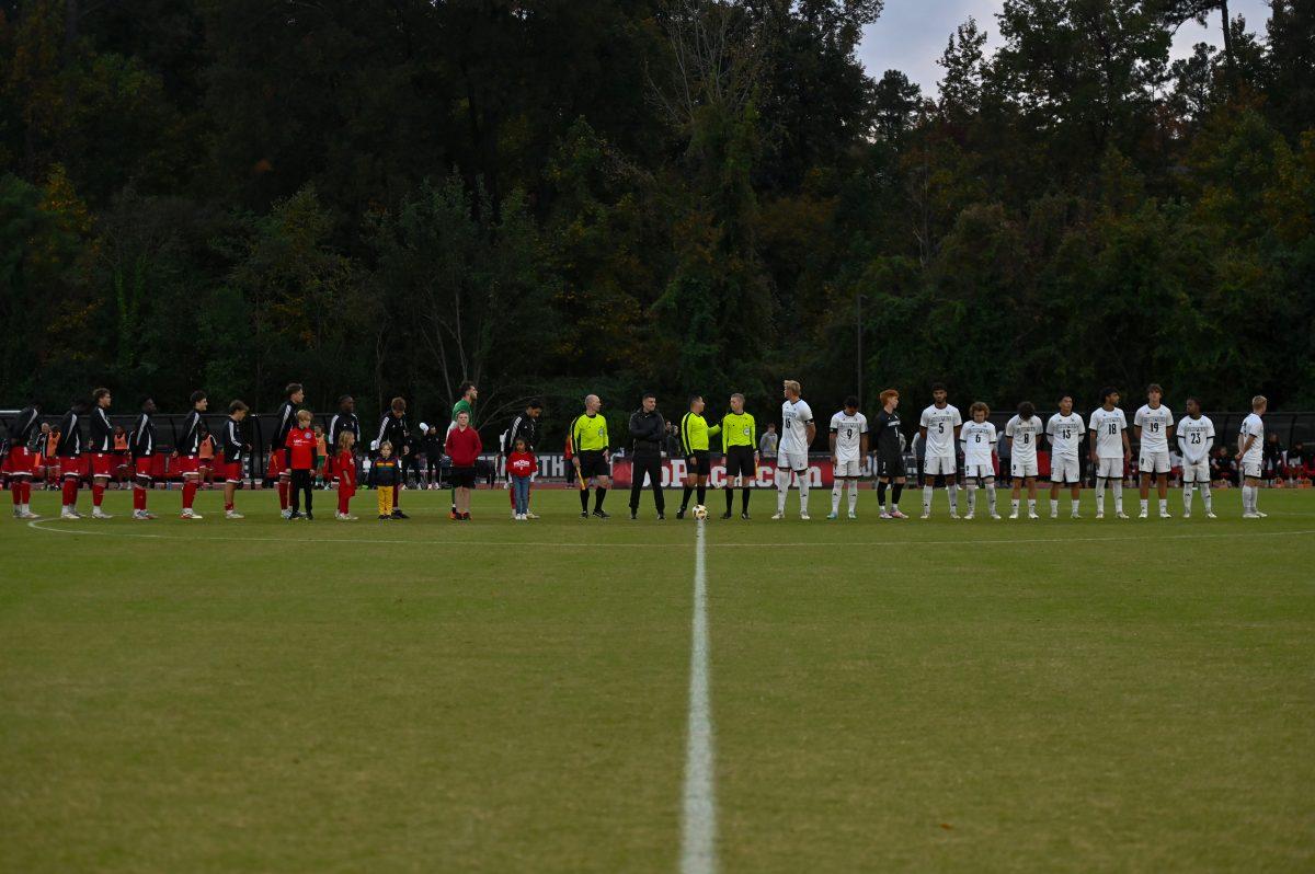 Both teams line up for player introductions and the national anthem before the game at Dail Soccer Field on Sunday, Oct. 27, 2024. NC State defeated Louisville 1-0.