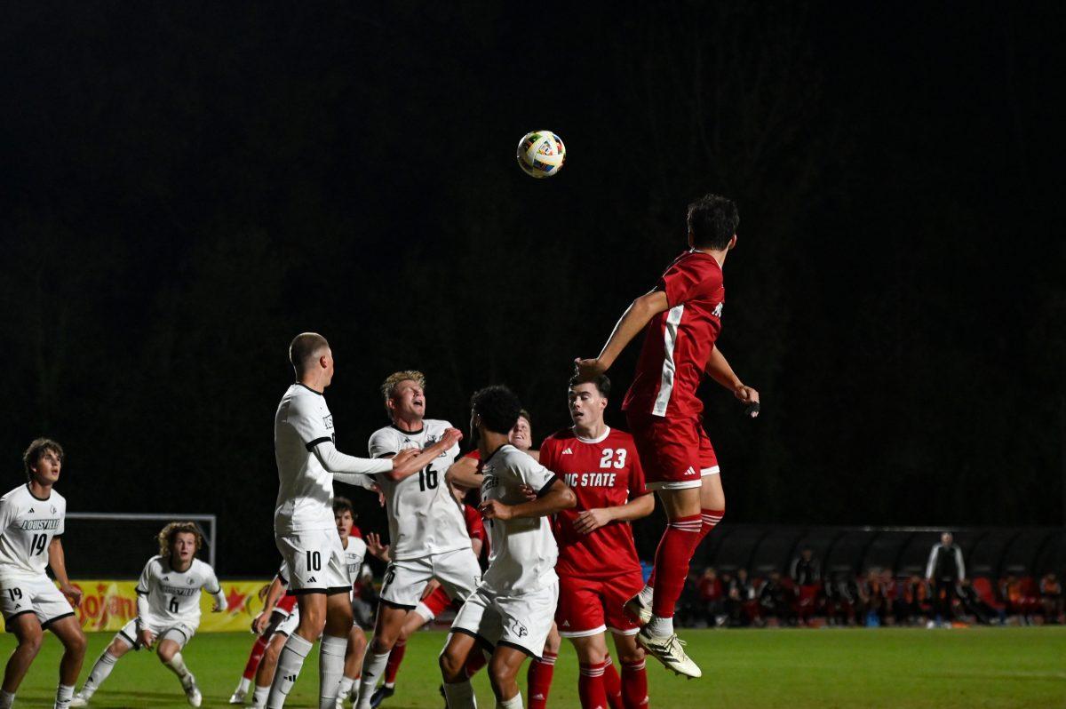 Wolfpack and Cardinal players battle for the incoming corner kick during the game at Dail Soccer Field,&#160;on Sunday, Oct. 27. NC State defeated Louisville 1-0.